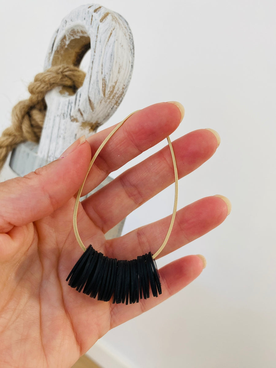 golden black upcycled bicycle inner tube hoop earrings by Laura Zabo, sustainable and eco-friendly jewellery by Laura Zabo