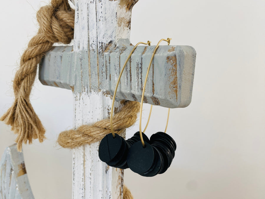 Glamorous and eco-friendly golden-black beaded upcycled bicycle inner tube hoop earrings, sustainable jewellery by Laura Zabo