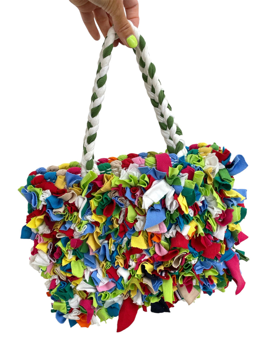 colourful upcycled fabric woven bag, eco friendly and sustainable bag on white background