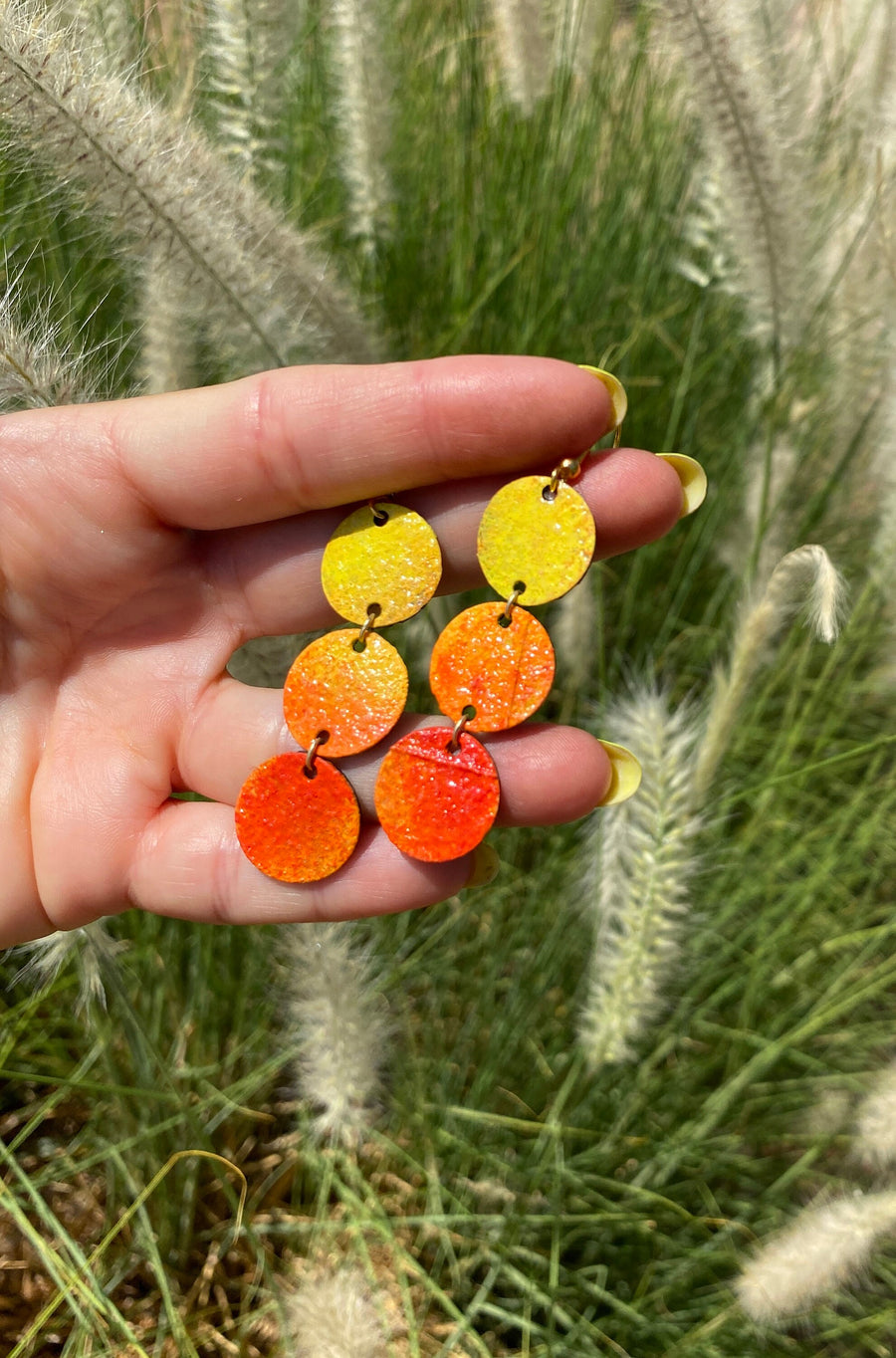 sunrise themed polka dot shaped upcycled bicycle inner tube earrings