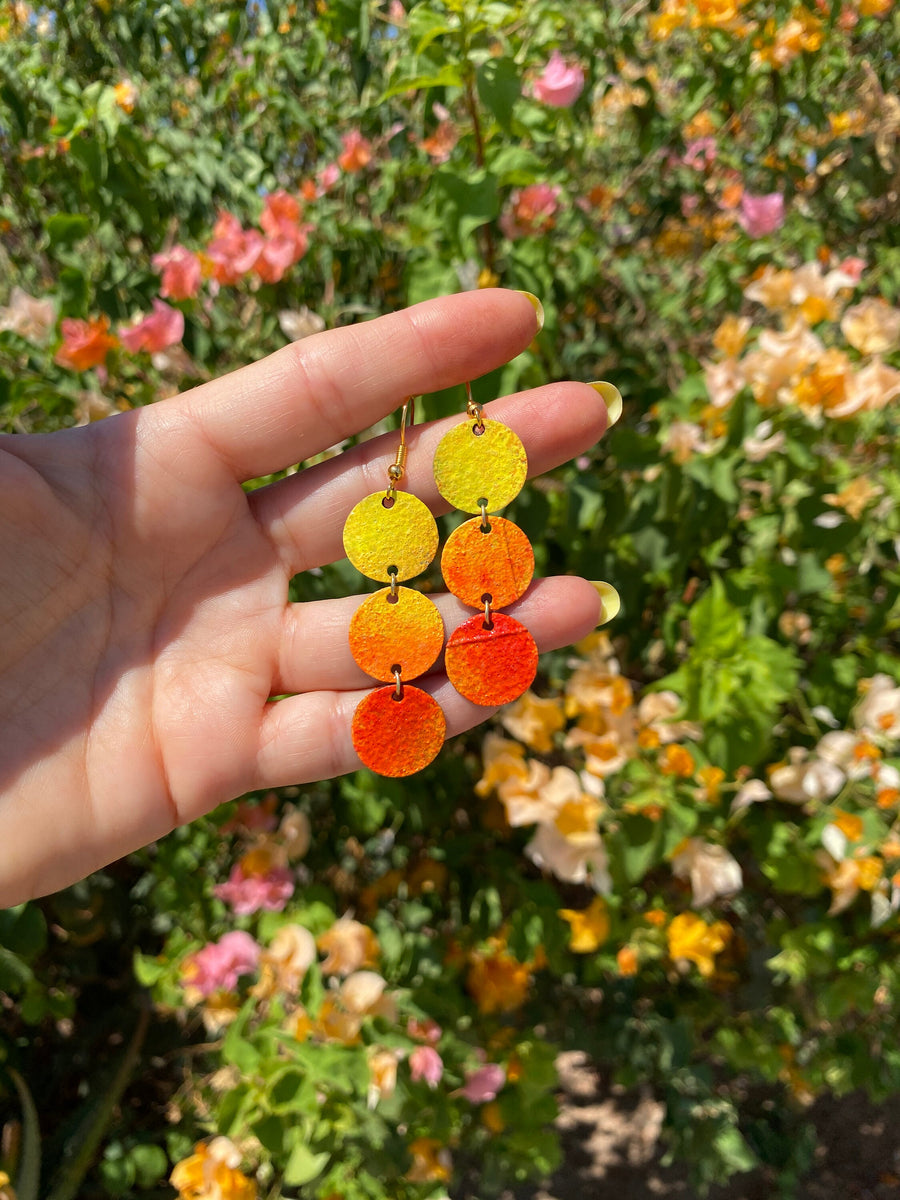 sunrise themed polka dot shaped upcycled bicycle inner tube earrings