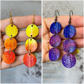 2 pairs of earrings, Sunrise and night themed earrings, in orange-yellow and blue-purple colours, made from upcycled bicycle inner tubes