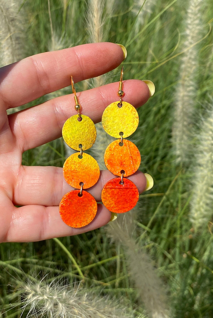 sunrise themed polka dot shaped upcycled bicycle inner tube earrings