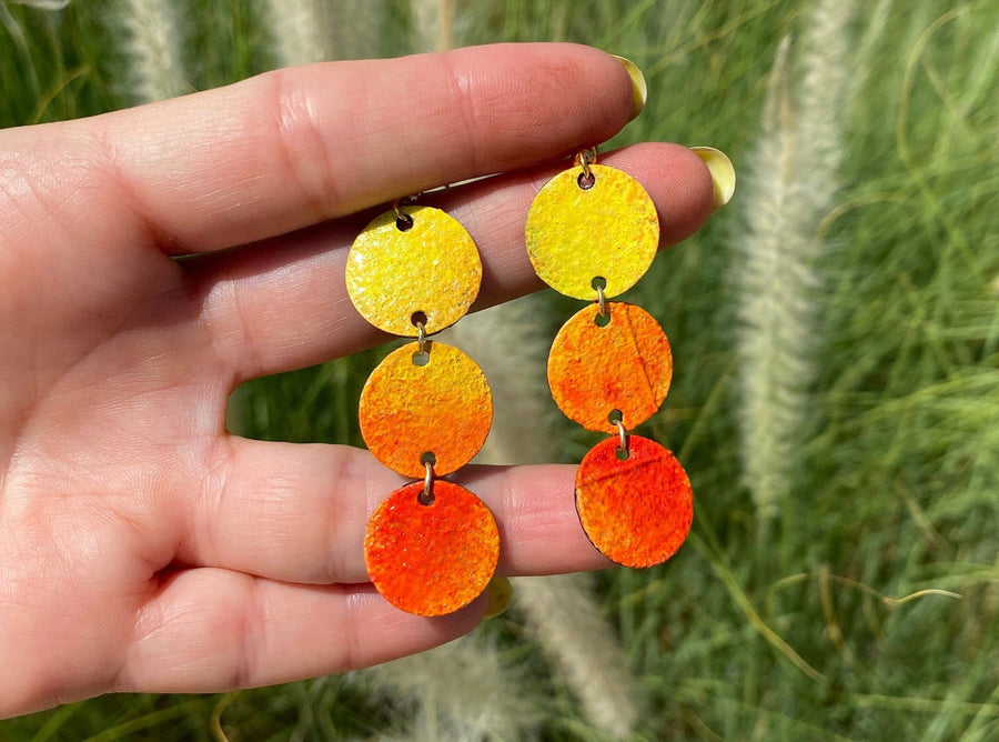 sunrise themed polka dot shaped upcycled bicycle inner tube earrings