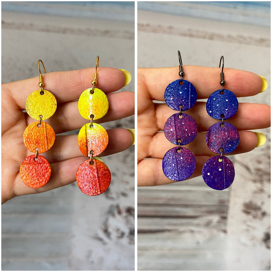 Sunrise and night themed earrings, in orange-yellow and blue-purple colours, made from upcycled bicycle inner tubes