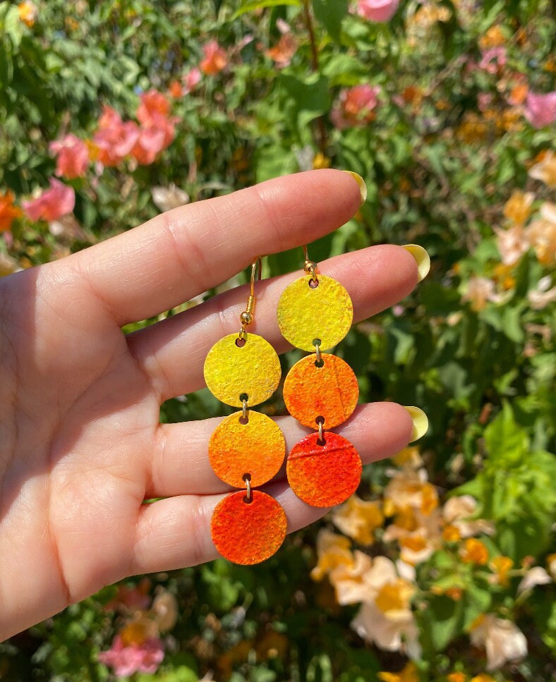 Sunrise themed earrings, in orange-yellow colours, made from upcycled bicycle inner tubes