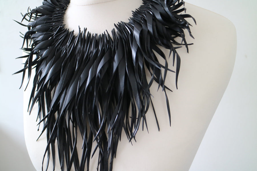 bold, chunky black statement necklace made out of recycled upcycled bike tyre rubber inner tube by Laura Zabo, bib necklace