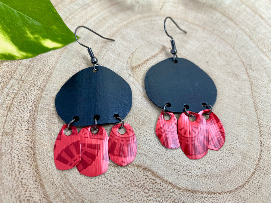 Bohemian, red black upcycled bike inner tube and Nespresso pod earrings on a wooden background