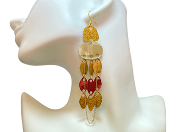 golden red upcycled nespresso capsules earrings with a golden chain on a white earrings display and white background