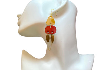 golden red bronze upcycled nespresso capsules earrings  on a white mannequin and white background