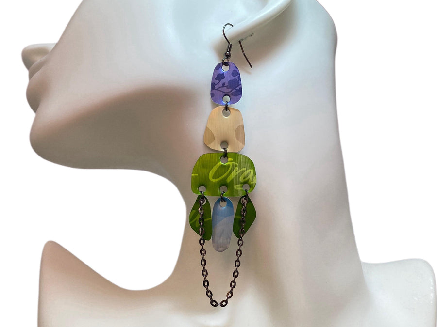 long, oriental, blue, sand, green earrings made from upcycled nespresso capsules on a white mannequin and white background