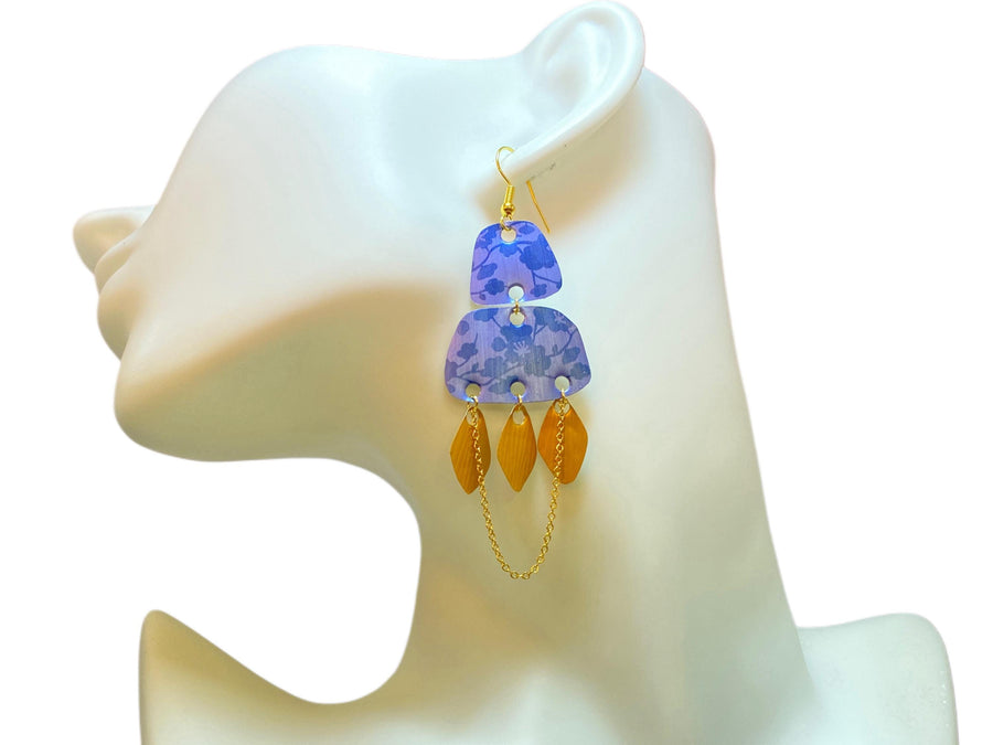 blue gold oriental, upcycled nespresso pod earrings on a white mannequin