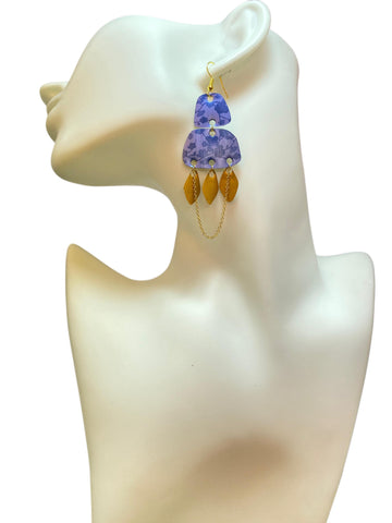 blue gold oriental, upcycled nespresso pod earrings on a white mannequin