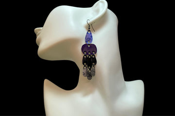 blue purple black silver earrings, oriental design made from upcycled nespresso capsules on a white mannequin and black  background