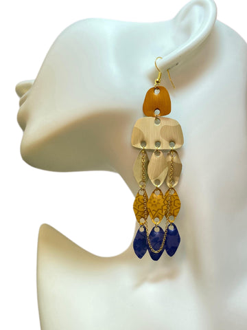 golden sand blue oriental earrings made from upcycled nespresso pods on a white mannequin and white background