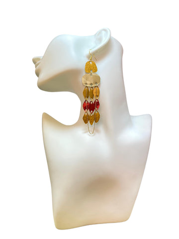 golden red upcycled nespresso capsules earrings with a golden chain on a white earrings display and white background