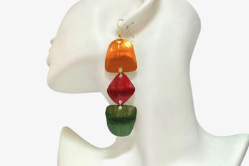 orange, red, green geometric earrings made from upcycled nespresso pods, on a white mannequin and background