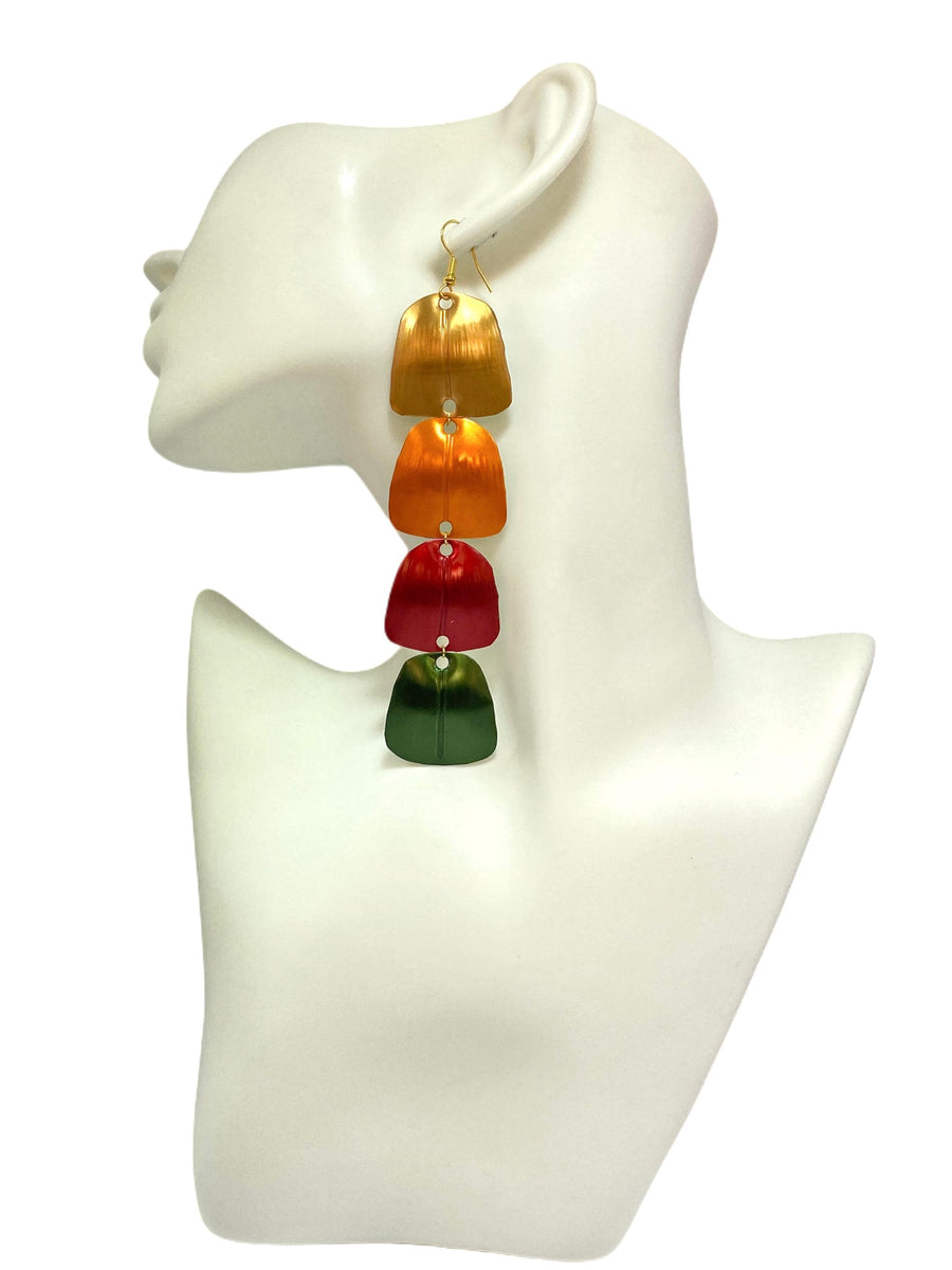 gold orange red green statement earrings made from Upcycled nespresso capsules on a white mannequin and white background