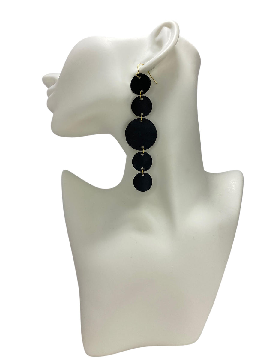 black golden upcycled bicycle inner tube, geometric earrings on a on a white head mannequin