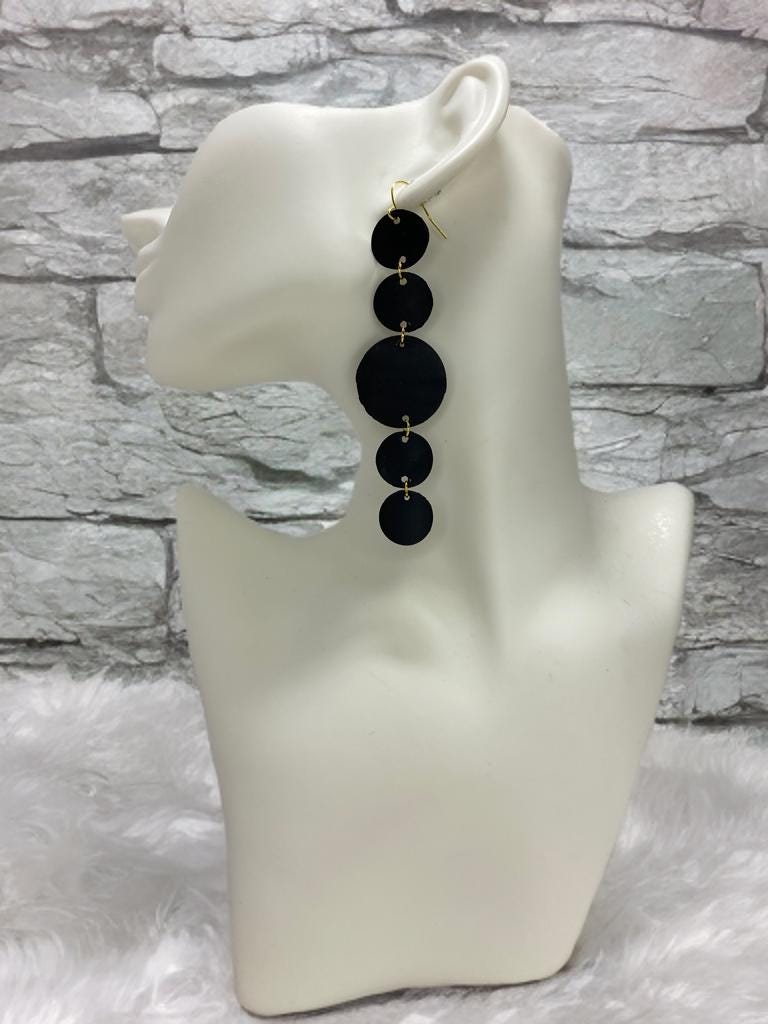 upcycled bicycle inner tube earrings, black disc earrings on a white mannequin