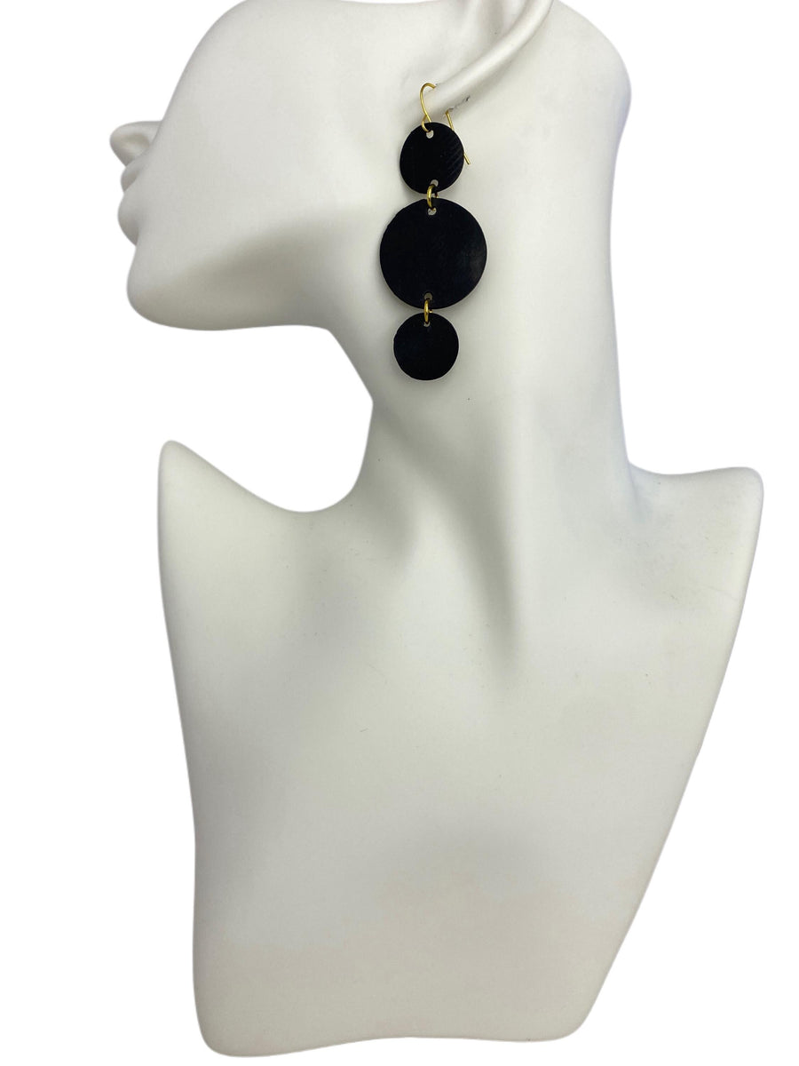 bicycle inner tube, black-golden, geometric, disc earrings on a white mannequin