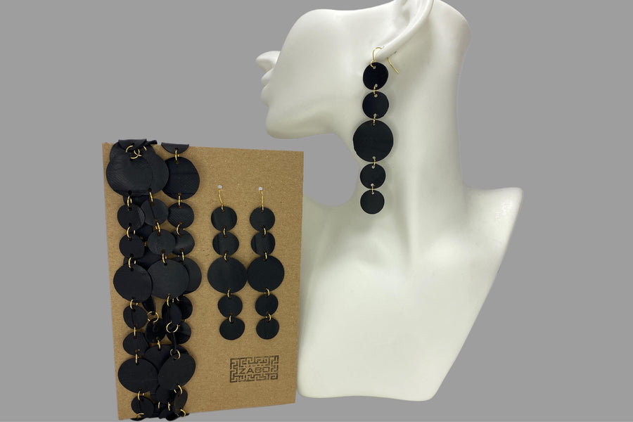 upcycled bicycle inner tube jewellery set, earrings and necklace on a display