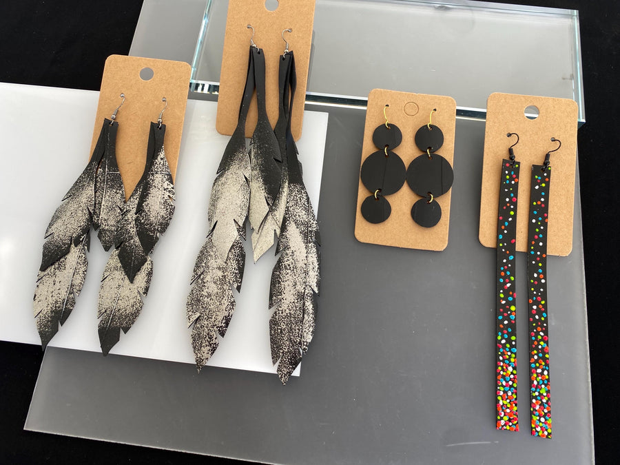 4 pairs of black silver upcycled bicycle inner tube earrings in different lengths and shapes, laura Zabo statement jewelry