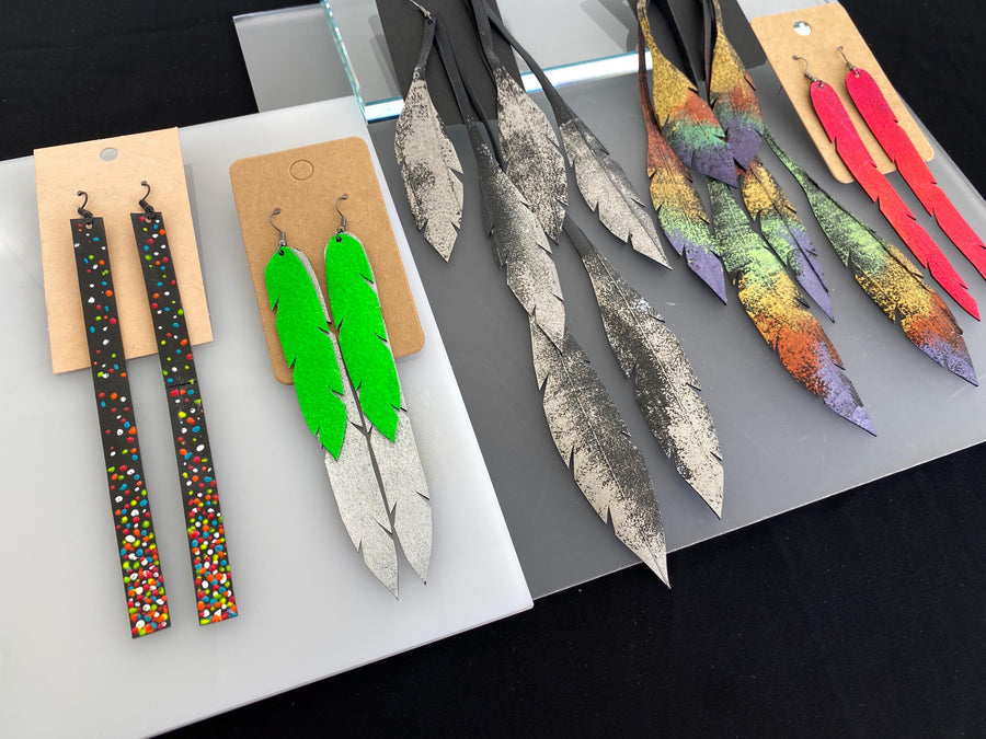 5 pairs of long, colourful upcycled bicycle inner tube earrings made by laura zabo