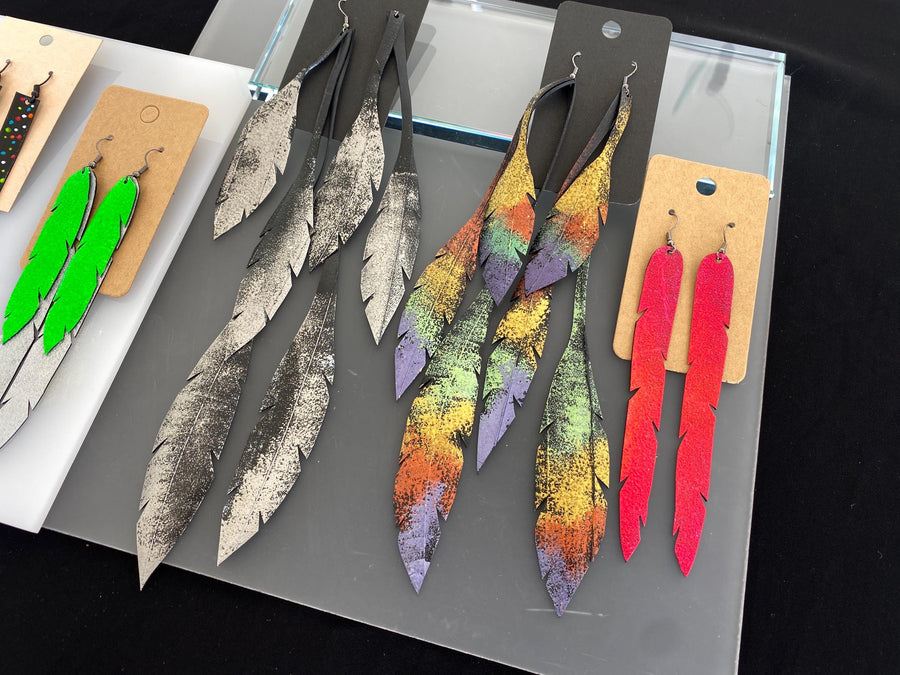 5 pairs of long, colourful upcycled bicycle inner tube earrings made by laura zabo