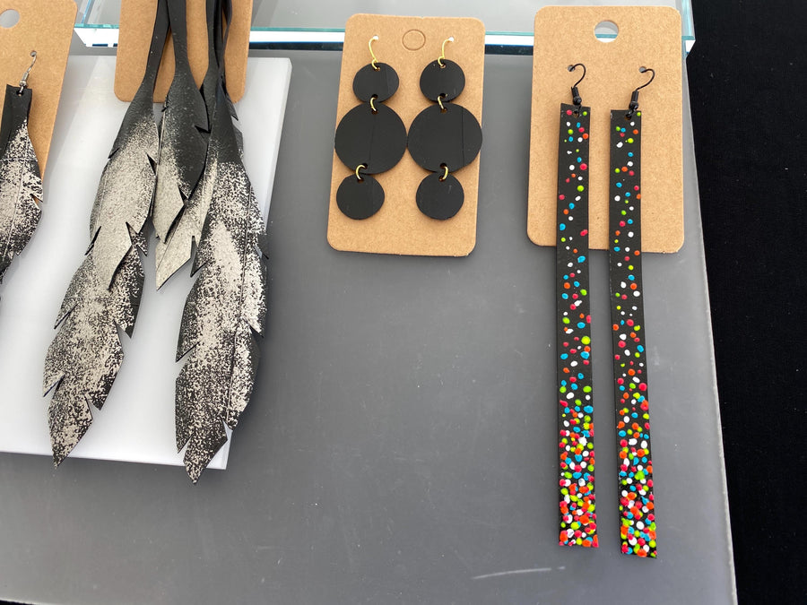 4 pairs of black silver upcycled bicycle inner tube earrings in different lengths and shapes, laura Zabo statement jewelry