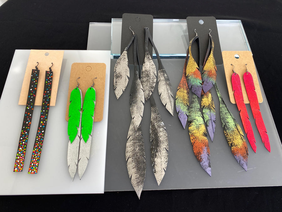 5 pairs of long, colourful upcycled bicycle inner tube earrings made by laura zabo
