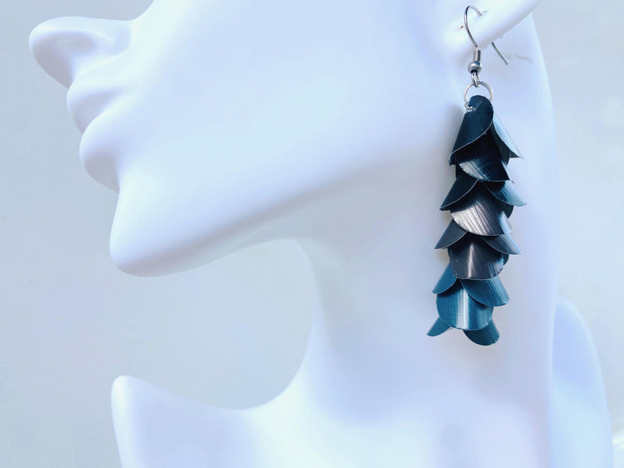 black grey cascading earrings made from upcycled nespresso pods on a white mannequin head
