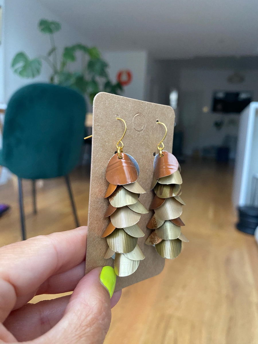gold bronze cascading earrings made from upcycled nespresso pods, capsules on a paper display