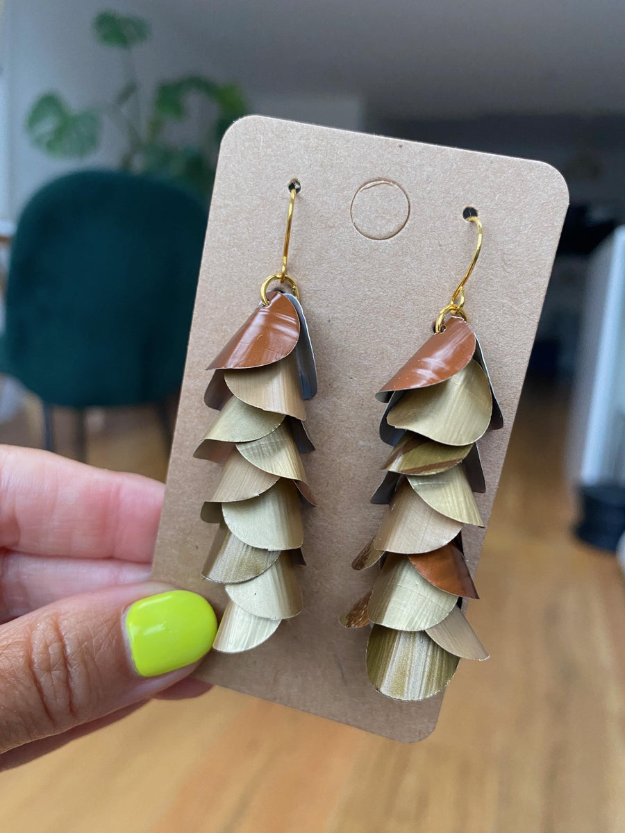 gold bronze cascading earrings made from upcycled nespresso pods, capsules on a paper display