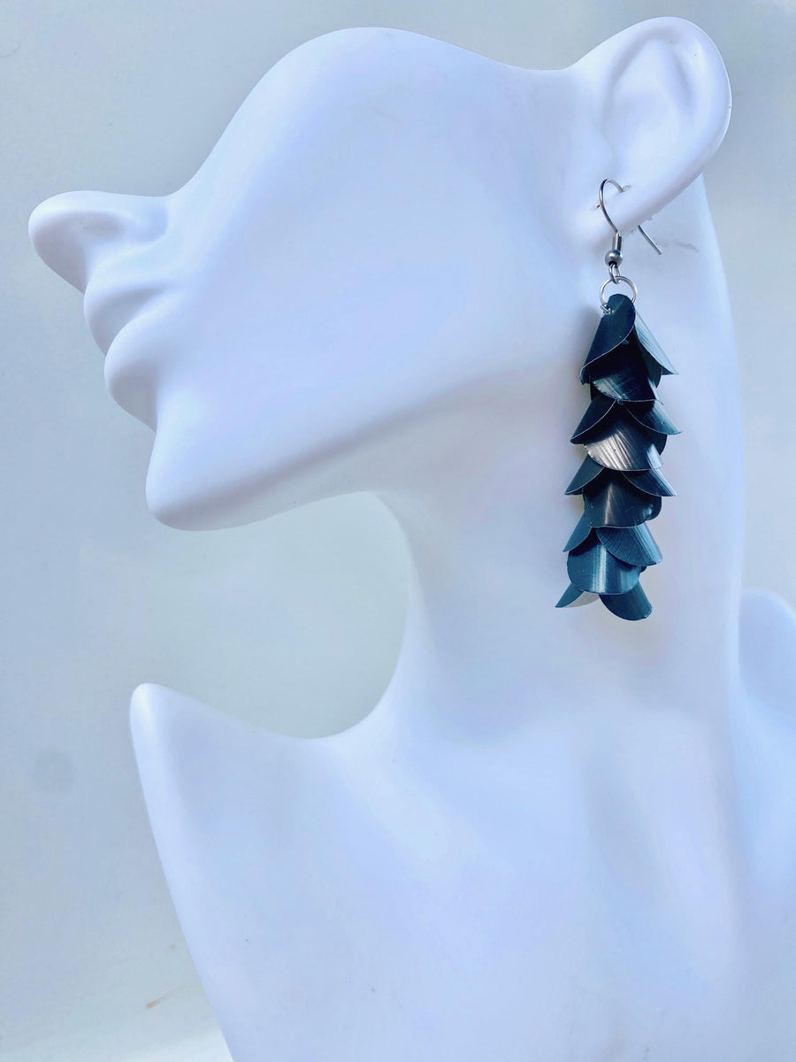 black grey cascading earrings made from upcycled nespresso pods on a white mannequin head