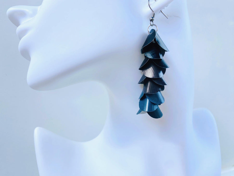 black grey cascading earrings made from upcycled nespresso pods on a white mannequin head