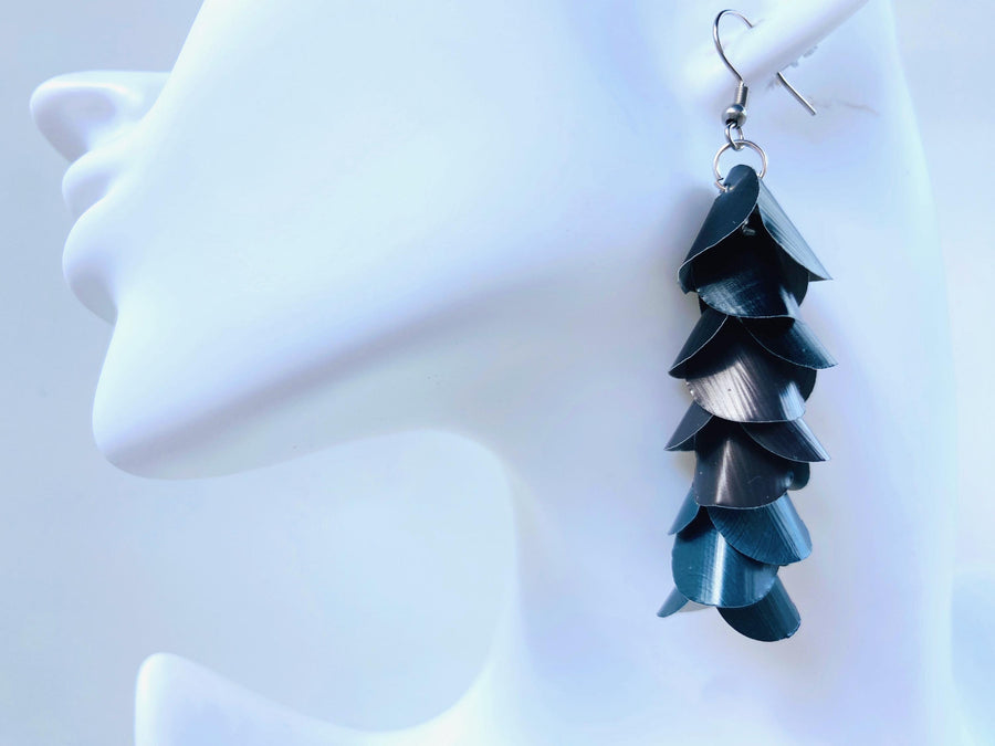 black grey cascading earrings made from upcycled nespresso pods on a white mannequin head