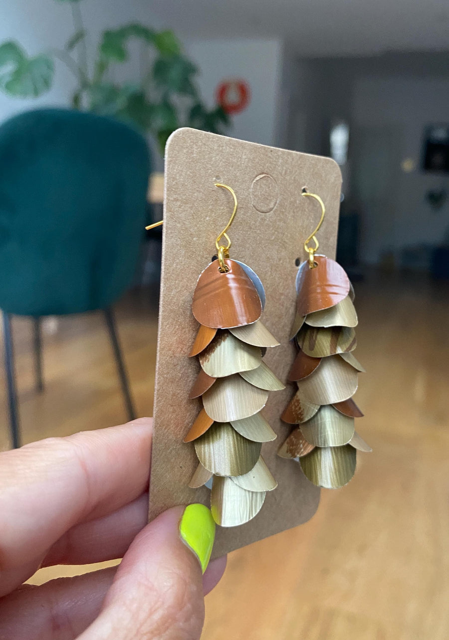 gold bronze cascading earrings made from upcycled nespresso pods, capsules on a paper display