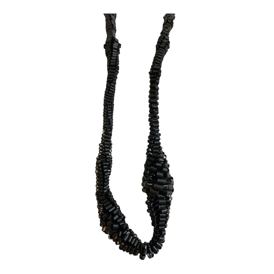 very bold, black scultural necklace made from upcycled bicycle inner tube strips on a mannequin