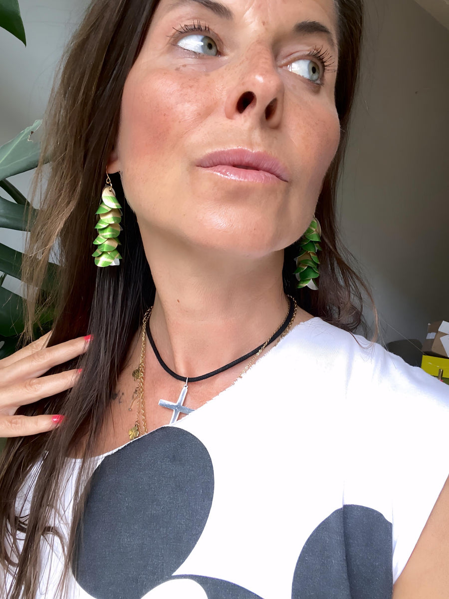 model wears lime green gold cascade earrings made from upcycled nespresso pod aluminium