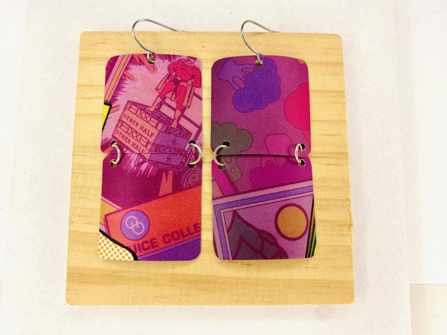 purple earrings made from upcycled craft beer can on a wooden and white background