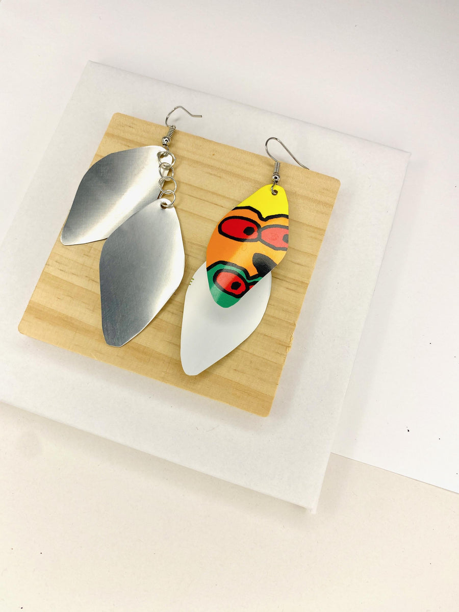 colourful cascade earrings made from upcycled craft beer cans on a wooden and white background