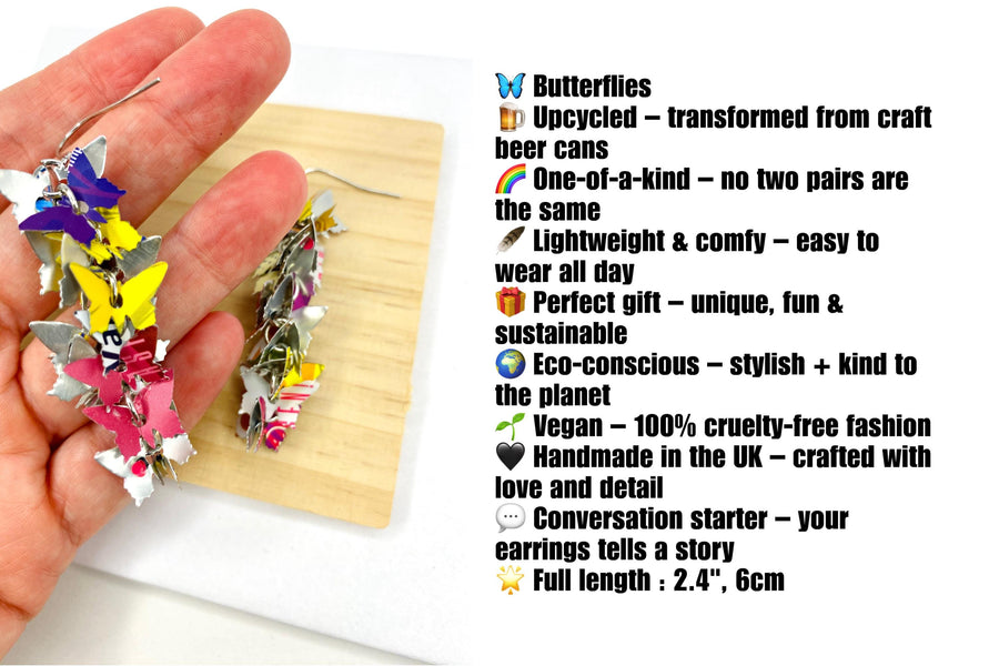 colourful, cascade statement earrings featuring tiny butterflies that are upcycled from craft beer cans on a wooden and white background with product description