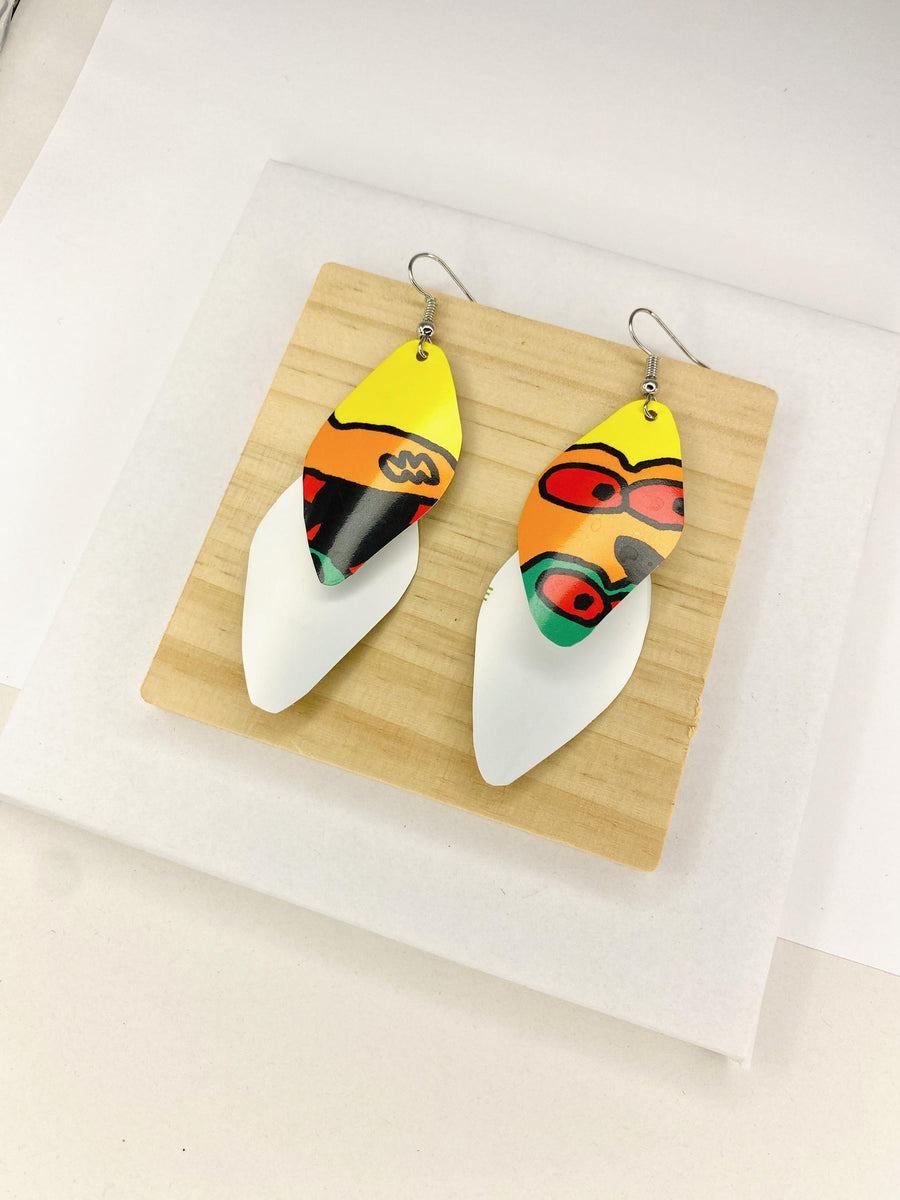 colourful cascade earrings made from upcycled craft beer cans on a wooden and white background