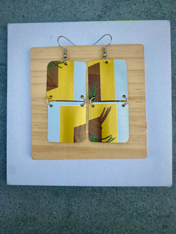 yellow white brown green earrings made from shiny soda cans by laura zabo on a white a grey background