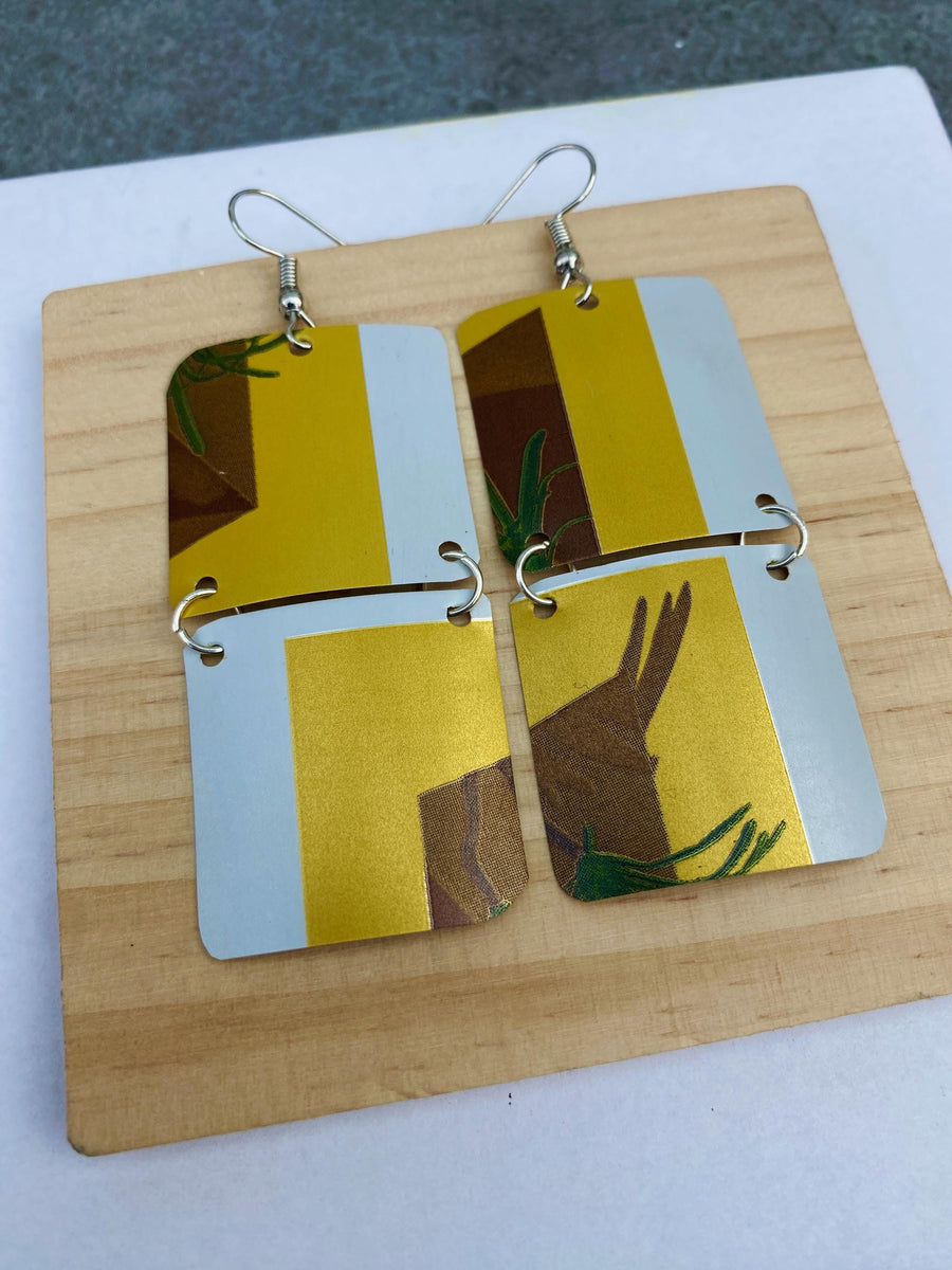 yellow white brown green earrings made from shiny soda cans by laura zabo on a white a grey background