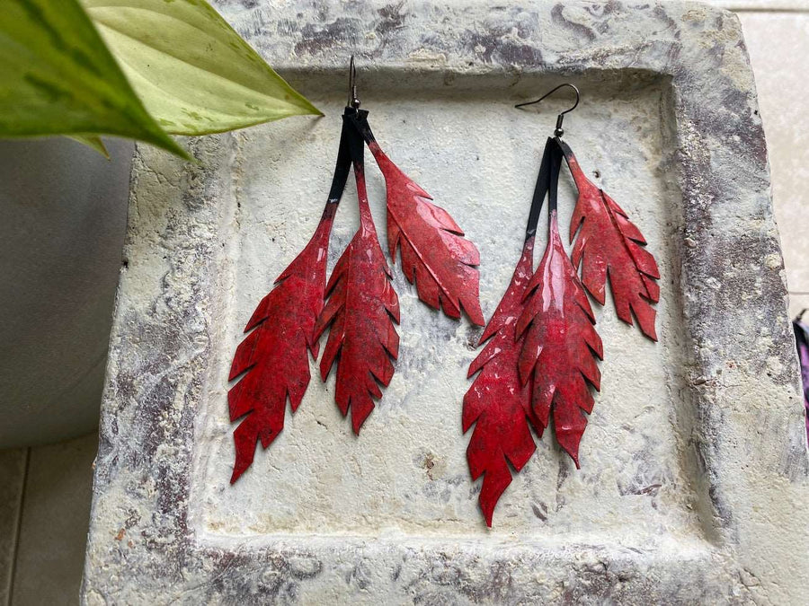 red leaf shaped statement earrings made from upcycled bicycle inner tube by Laura Zabo
