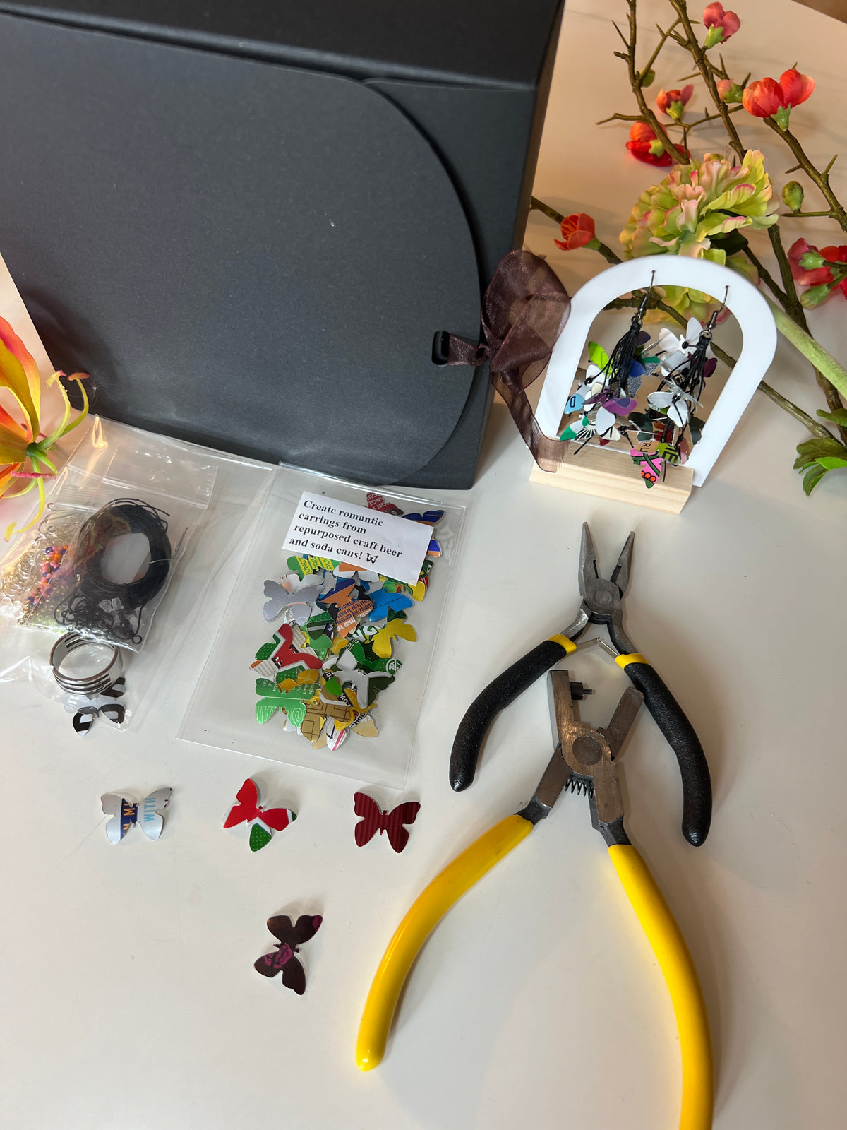 laura zabo beginner upcycling craft kit with aluminium butterflies cut from soda and beer cans, craft pliers, black gift box